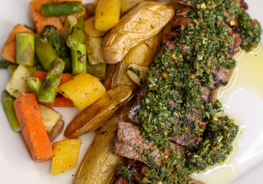 Steak, potato wedges and mixed vegetables on a plate